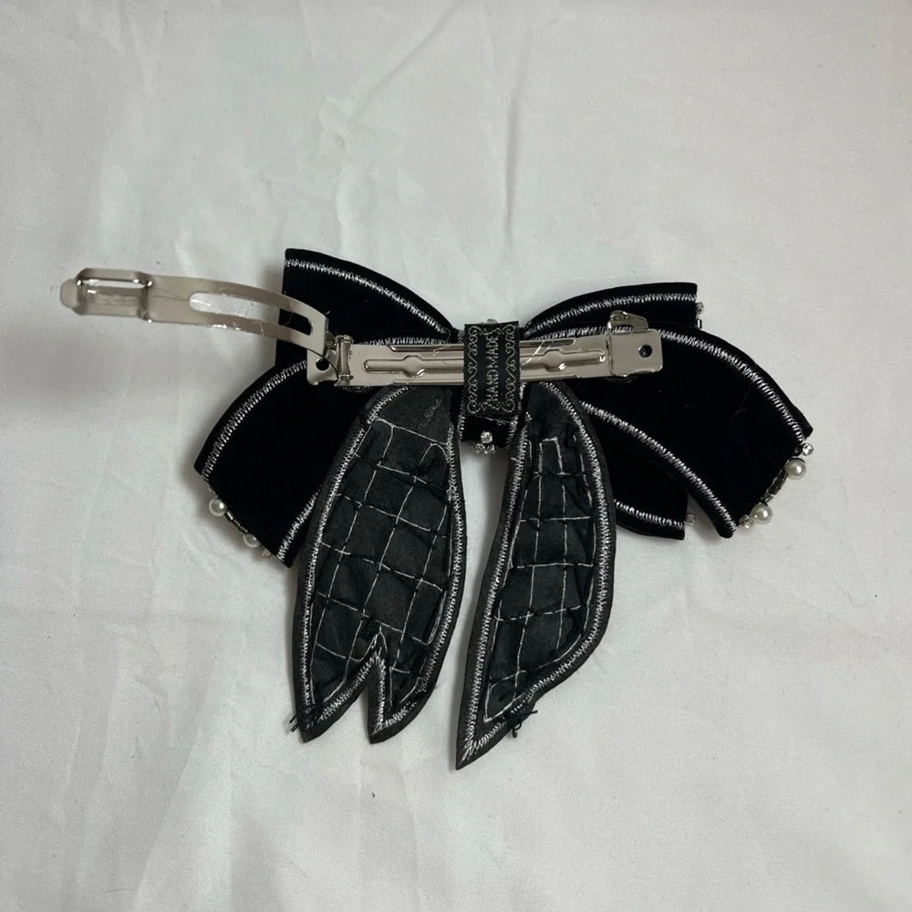 Elegant Black and Silver Bow Accessory